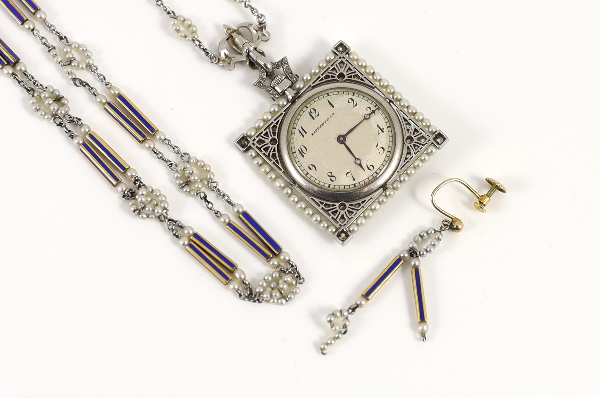 An early 20th century Tiffany & Co platinum, seed pearl and diamond set pendant square open faced dress timepiece, on a platinum, gold, enamel and seed pearl set chain, together with a matching 9ct bracelet and 9ct earri